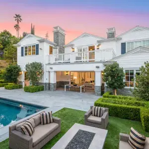 upscale white house with pool